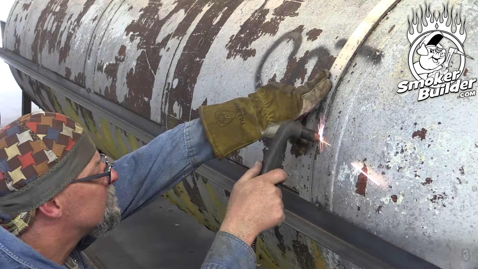 Frank Cox cutting the cook chamber doors on a propane tank