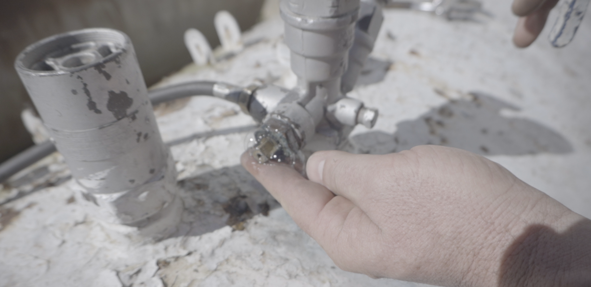 Close-up of the valves still installed on top of a used propane tank